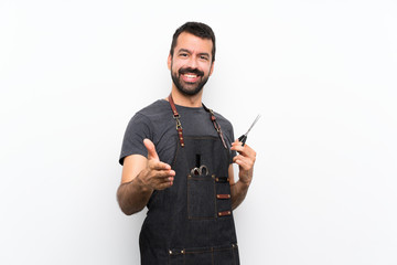 Barber man in an apron shaking hands for closing a good deal