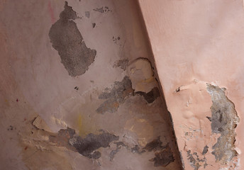 A dirty and damaged wall