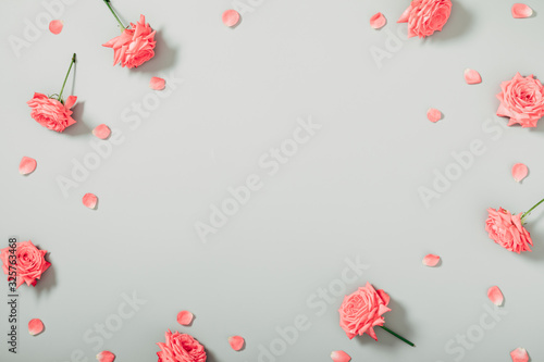 Beautiful flowers composition. Pink rose flowers on gray background. Valentines Day, Easter, Birthday, Happy Women's Day, Mother's day. Flat lay, top view, copy space
