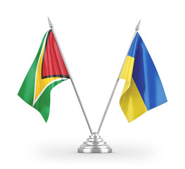 Ukraine and Guyana table flags isolated on white 3D rendering