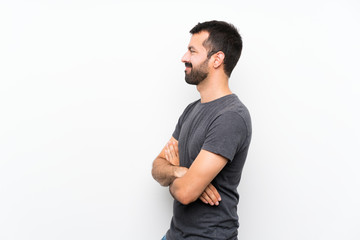 Young handsome man over isolated white background in lateral position