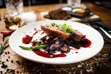 Duck breast served on a plate in restaurant