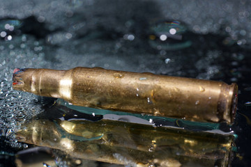 Ammunition for toy guns photographed on mirror in studio