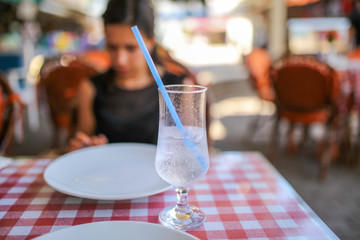 A glass of cold water with ice on the table