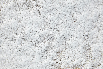 Graupel, snow pellets or soft hail texture, background. Form of precipitation
