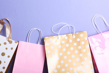 packages for shopping on a colored background top view. Minimalism, place for text.