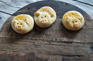 Funny children's food, pig buns on the wooden board, traditional from Serbia