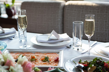 Served for banquet restaurant table with dishes, snack, wine glasses