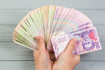 Stack of ukrainian hryvnia banknotes in hands