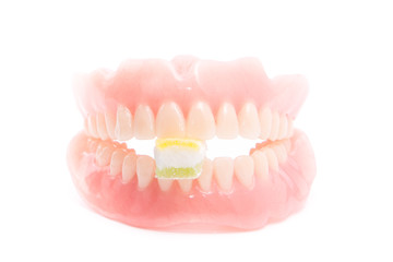 Jelly inserted into the denture isolated on white background.