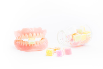 Jelly inserted into the denture isolated on white background.