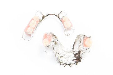 removable partial denture on white background.