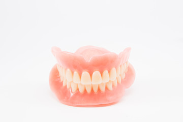 complte denture on white background