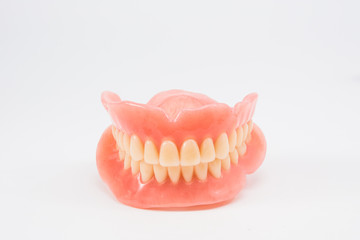 complte denture on white background