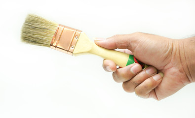 Paint brush in the hands of a man on a white background