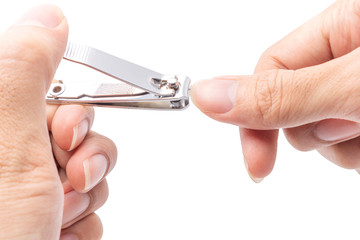 Close up cutting long fingernails and dirty using nail clipper, isolated on white background with clipping path, health care protection and cleanliness concept.