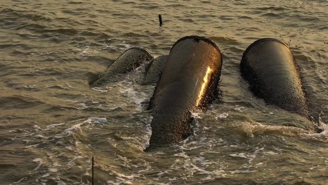 The pipes in the sea were beaten by waves. Underwater pipeline, Production tubing casing and structure with marine. 