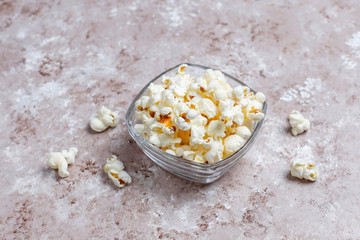 Salty snacks. Pretzels, chips, crackers,popcorn in bowls. Unhealthy products. food bad for figure, skin, heart and teeth. Assortment of fast carbohydrates food