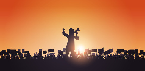 silhouette of man with megaphone over crowd protesters holding protest posters men women with blank vote placards demonstration speech political freedom concept horizontal portrait vector illustration