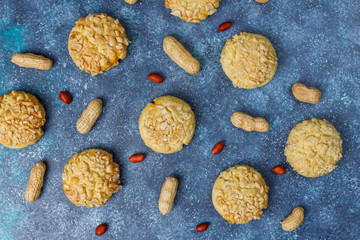 Homemade crunchy cookies with peanuts on grey background,top view