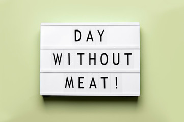 holiday international day without meat the inscription on the lightbox which is on a green background