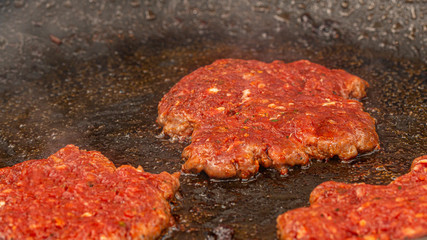 Raw minced meat in the pan