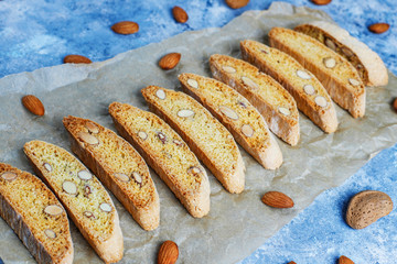 Italian tuscan traditional cookies cantuccini with almonds on grey concrete background,top view