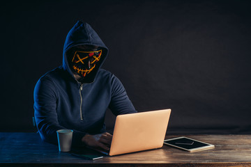 hacker man sit with laptop try to get password or to enter computer system, computer genius engaged...
