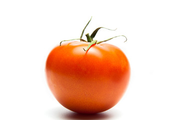 Fresh tomatoes. Red with a green spine. Vegetarian food. On white background