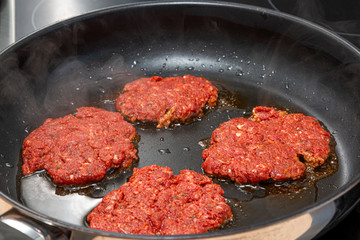 Raw minced meat in the pan