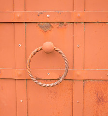 Old wrought-iron gates with a ring