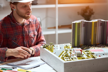 talented architects making notes on the blueprint, close up photo