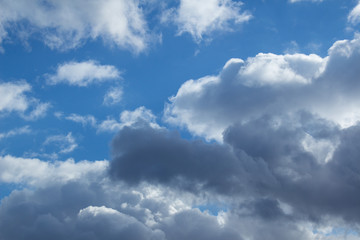 Fototapeta na wymiar Beautiful large clouds against a clean blue sky
