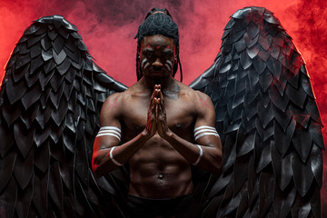 afro-american young guy became dark angel and fall from heaven to be with all alive people, he is suffering from pain of being among the dead. fantasy, gothic cocnept