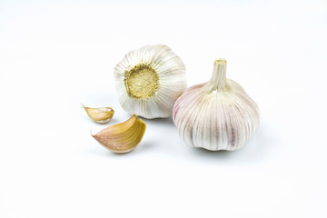 Two heads of garlic isolated on a white background.
