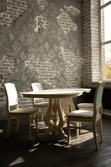 A set of furniture for the kitchen in the loft interior. A collection of chairs and tables for dinner in the family circle.