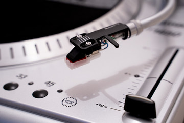 pickup head silver vinyl turntable  © Leonid Aleksandrov
