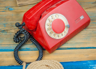 Vintage old dial telephone on the wooden table