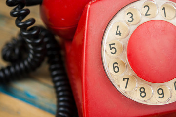 Vintage old dial telephone on the wooden table