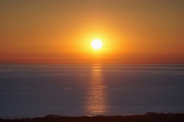 Sun sets over the sea in Versilia