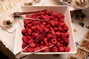 red raspberries are in a bowl