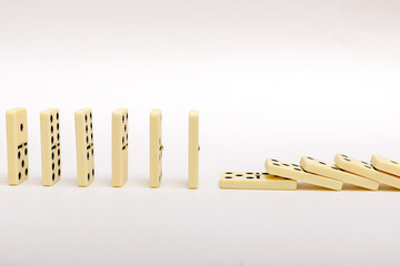 Domino background. Business strategy concept. The domino effect stopped by a unique, one strong...