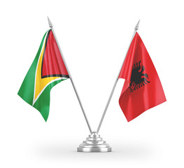 Albania and Guyana table flags isolated on white 3D rendering