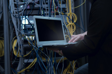 Engineer with toolboxs come to server room for work,check problem of network,repair server in the server room,thailand people,asian man