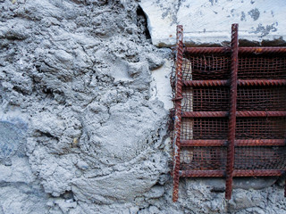 iron grate on the wall. window with iron shutters