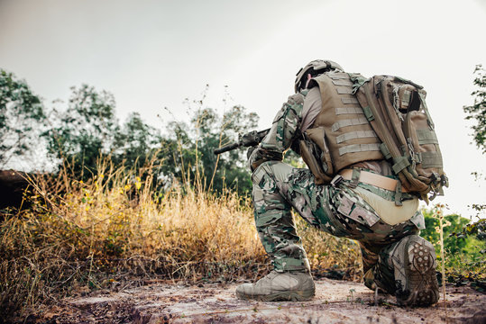 The soldiers pointed a gun at the enemy,selective focus