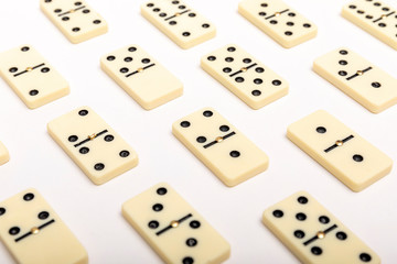 Photo of different dominoes. Background of dominoes. Hobbies collecting on white background.