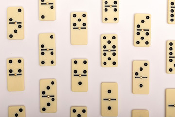 Photo of different dominoes. Background of dominoes. Hobbies collecting on white background.
