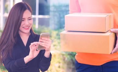 Woman making mobile shopping and fast delivery for E commerce and online shopping concept.