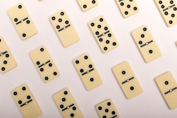 Photo of different dominoes. Background of dominoes. Hobbies collecting on white background.